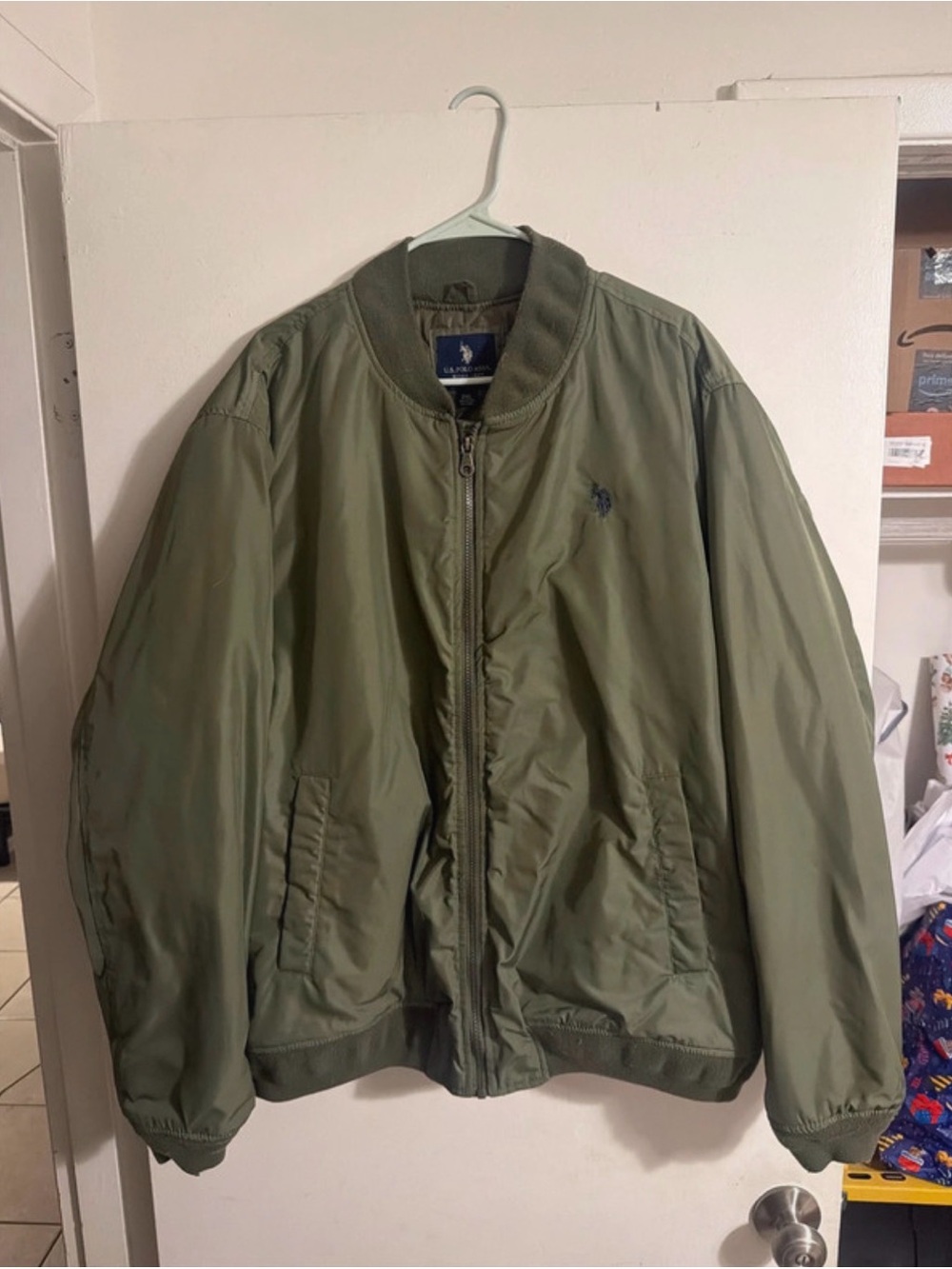 U.S. Polo Assn. men’s lightweight bomber jacket in olive/army green. Size 2XL.
